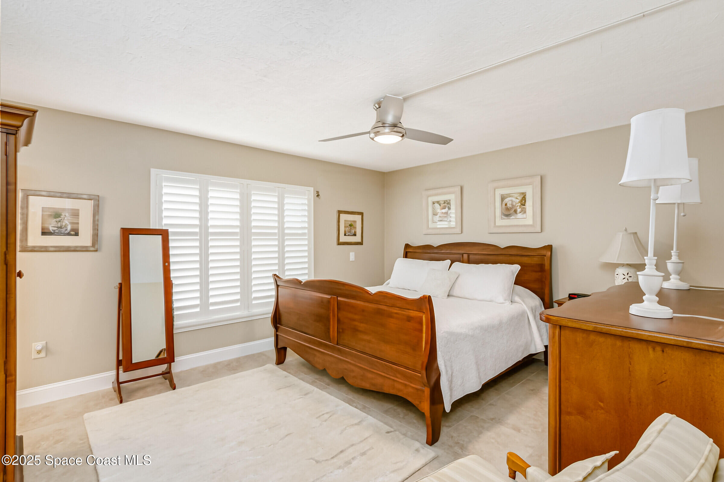3060 North Atlantic Ave Corner, Unit 301 Cocoa Beach, FL 32931 - Photo 22 of 60 Primary Bedroom Suite