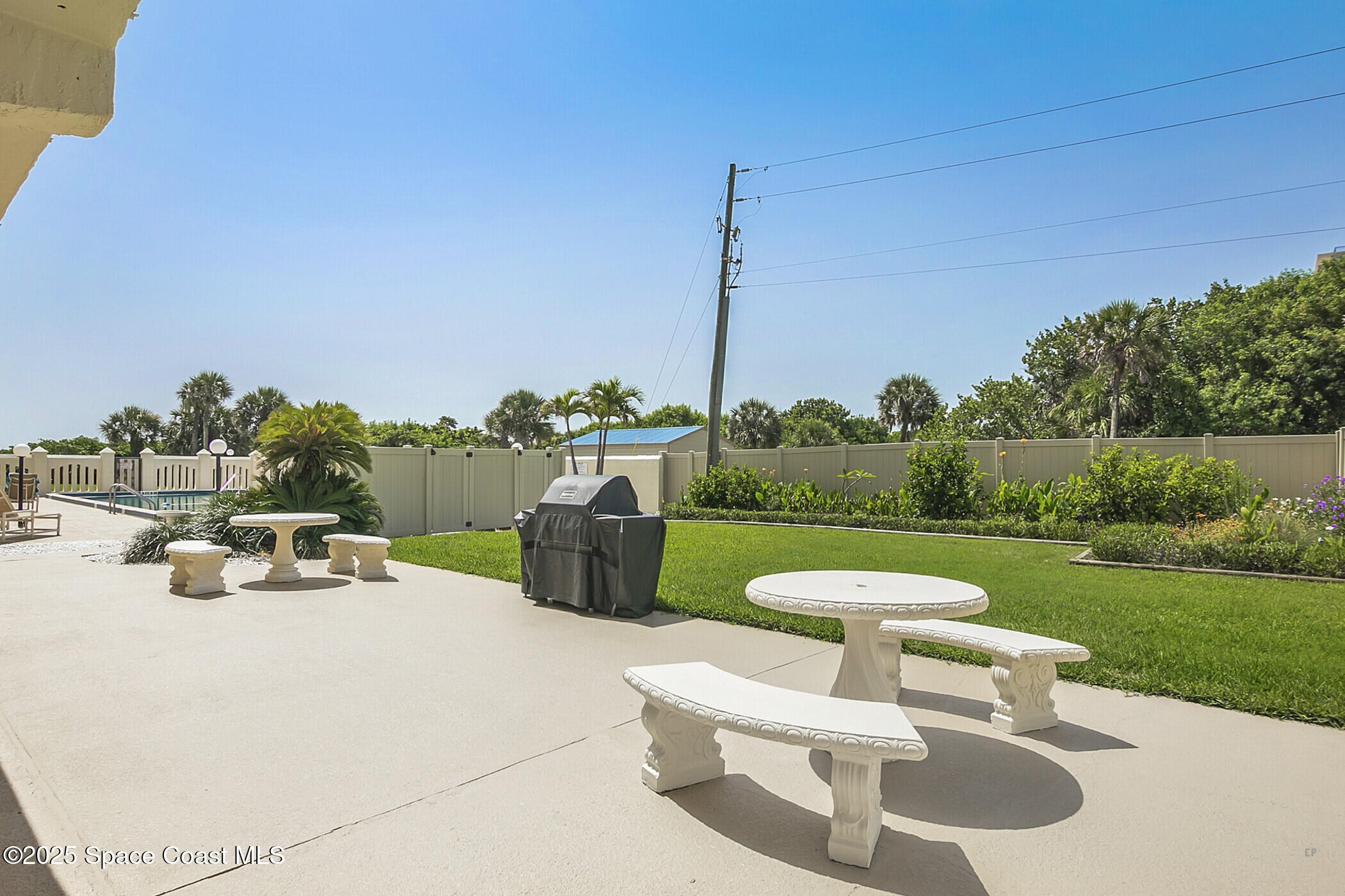 3060 North Atlantic Ave Corner, Unit 301 Cocoa Beach, FL 32931 - Photo 40 of 60 Grill and Picnic Tables
