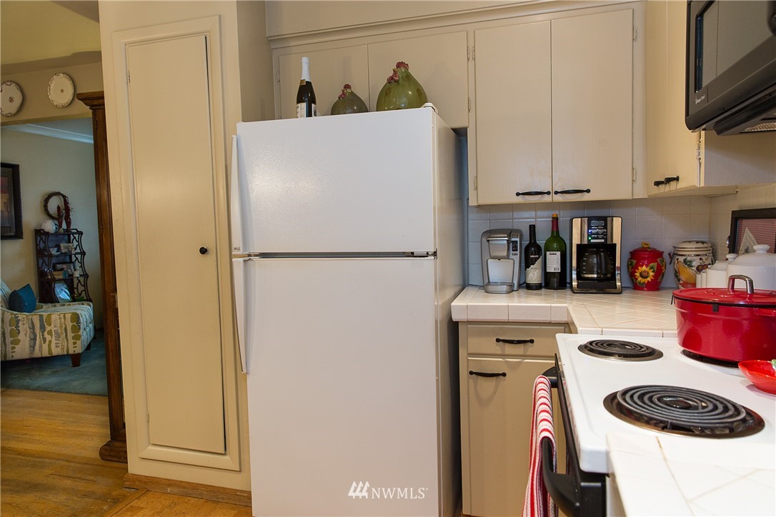 1419 18th Street Everett, WA 98201 - Photo 11 of 21 a white refrigerator freezer sitting inside of a kitchen