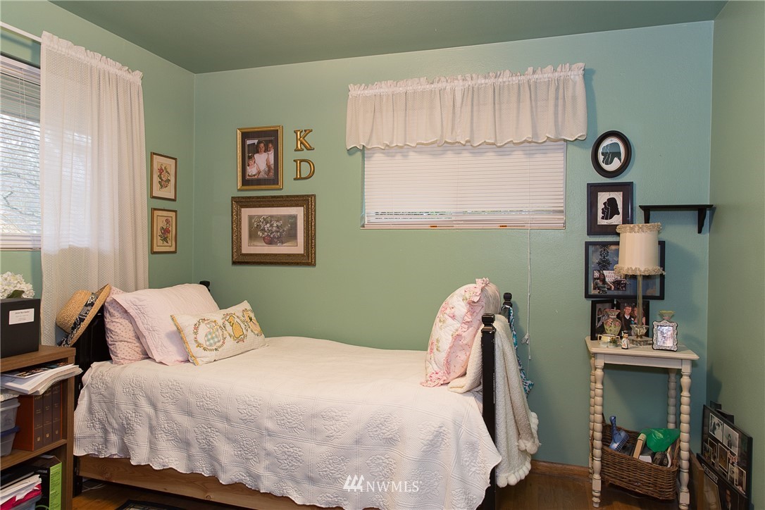 1419 18th Street Everett, WA 98201 - Photo 14 of 21 a bedroom with a bed and a window