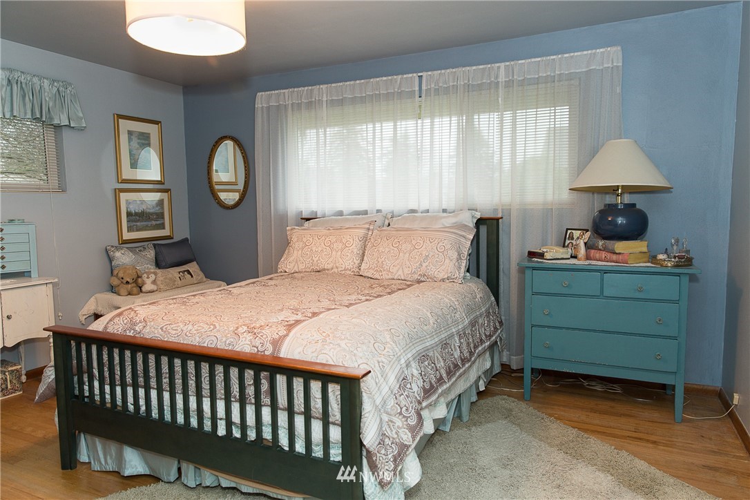 1419 18th Street Everett, WA 98201 - Photo 15 of 21 a bedroom with a bed and a window
