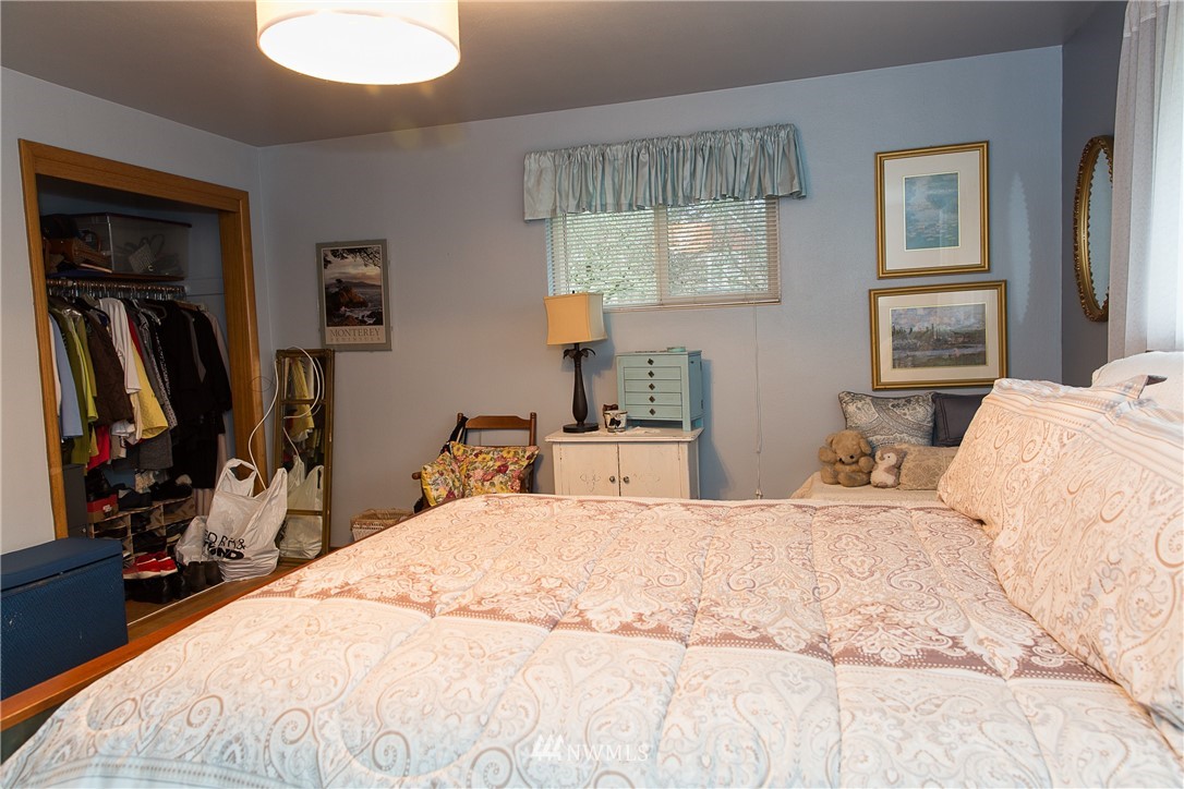1419 18th Street Everett, WA 98201 - Photo 16 of 21 a bedroom with a bed and a dresser
