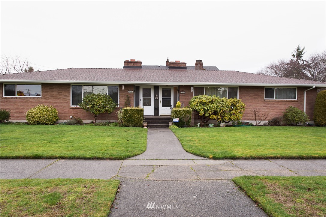 1419 18th Street Everett, WA 98201 - Photo 19 of 21 a front view of a house with garden