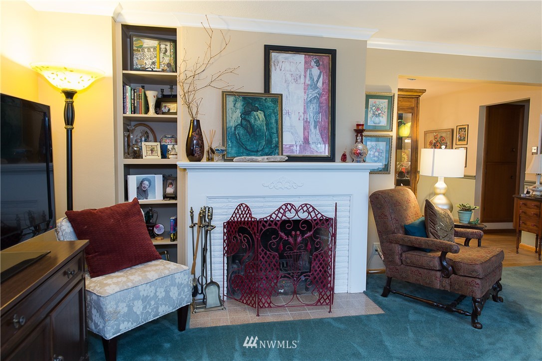 1419 18th Street Everett, WA 98201 - Photo 6 of 21 a living room with furniture a flat screen tv and a fireplace