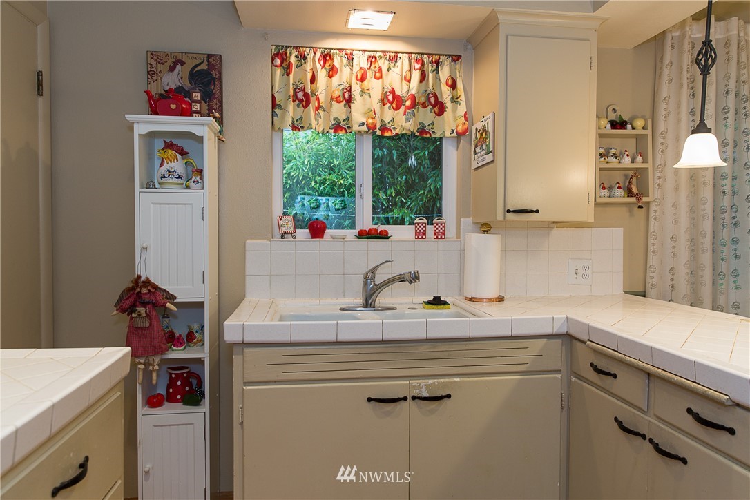 1419 18th Street Everett, WA 98201 - Photo 10 of 21 a kitchen with a sink cabinets and window