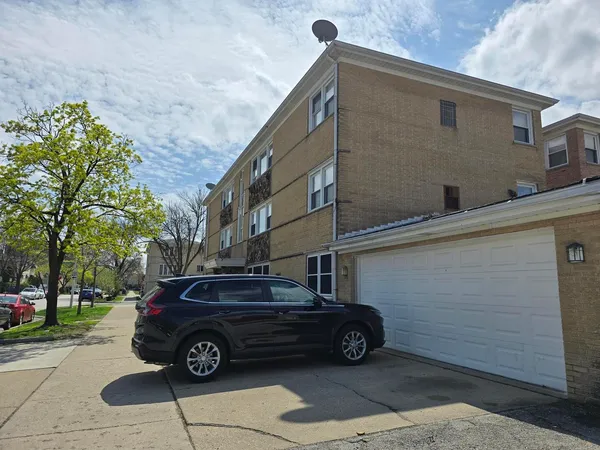 a car parked in front of a house