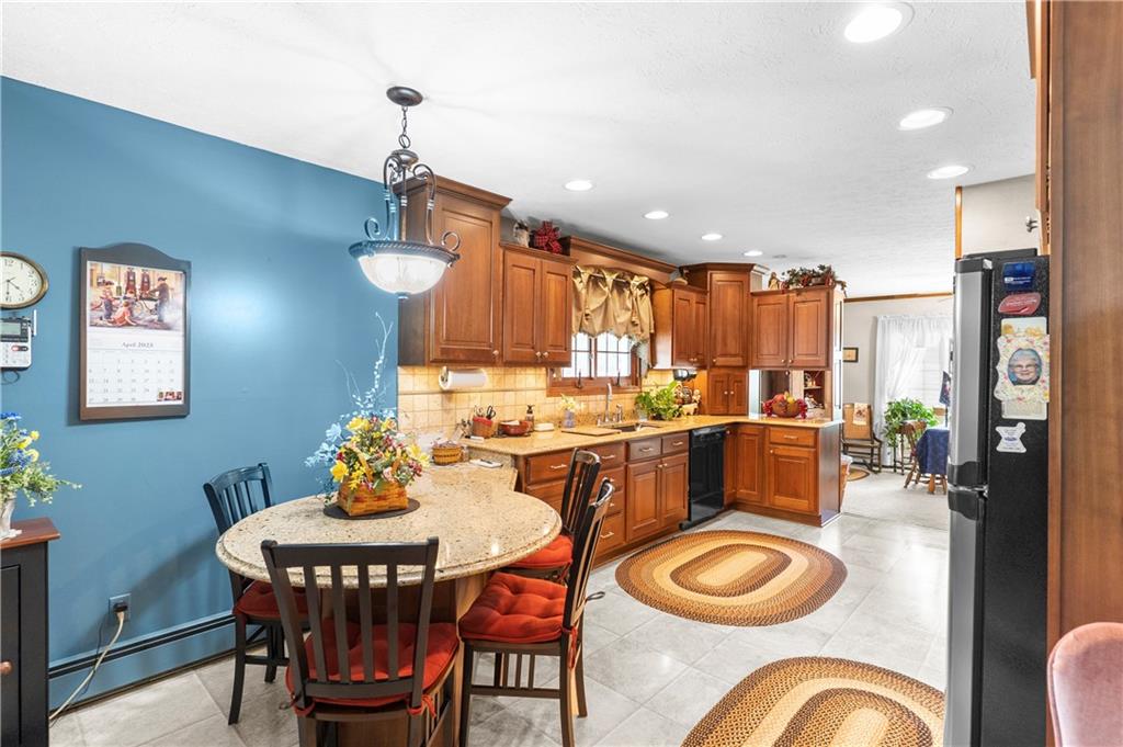 946 Crouser School Road Sandy Lake, PA 16145 - Photo 12 of 41 a dining room filled chandelier and wooden floor