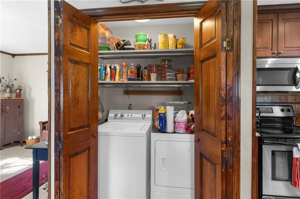 946 Crouser School Road Sandy Lake, PA 16145 - Photo 14 of 41 a utility room with dryer and washer
