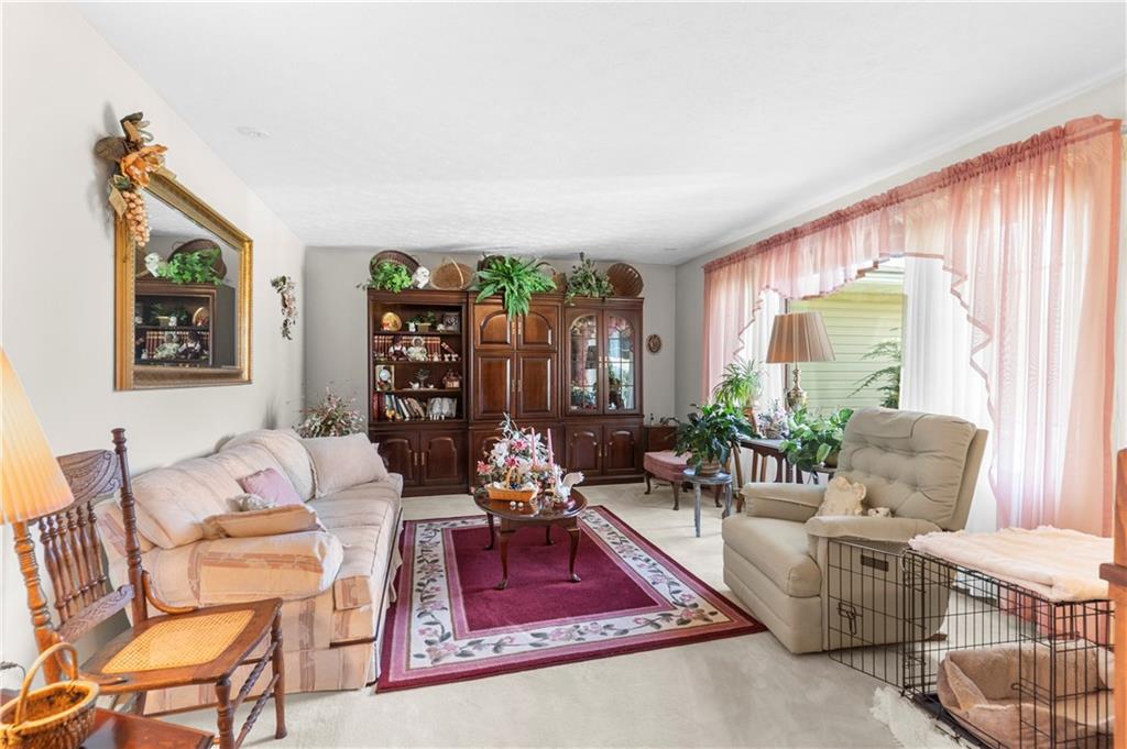 946 Crouser School Road Sandy Lake, PA 16145 - Photo 20 of 41 a living room with furniture and a large window