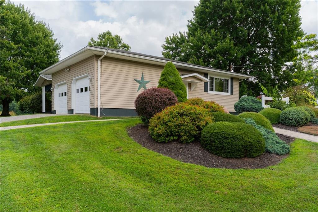 946 Crouser School Road Sandy Lake, PA 16145 - Photo 3 of 41 a house with green field in front of it