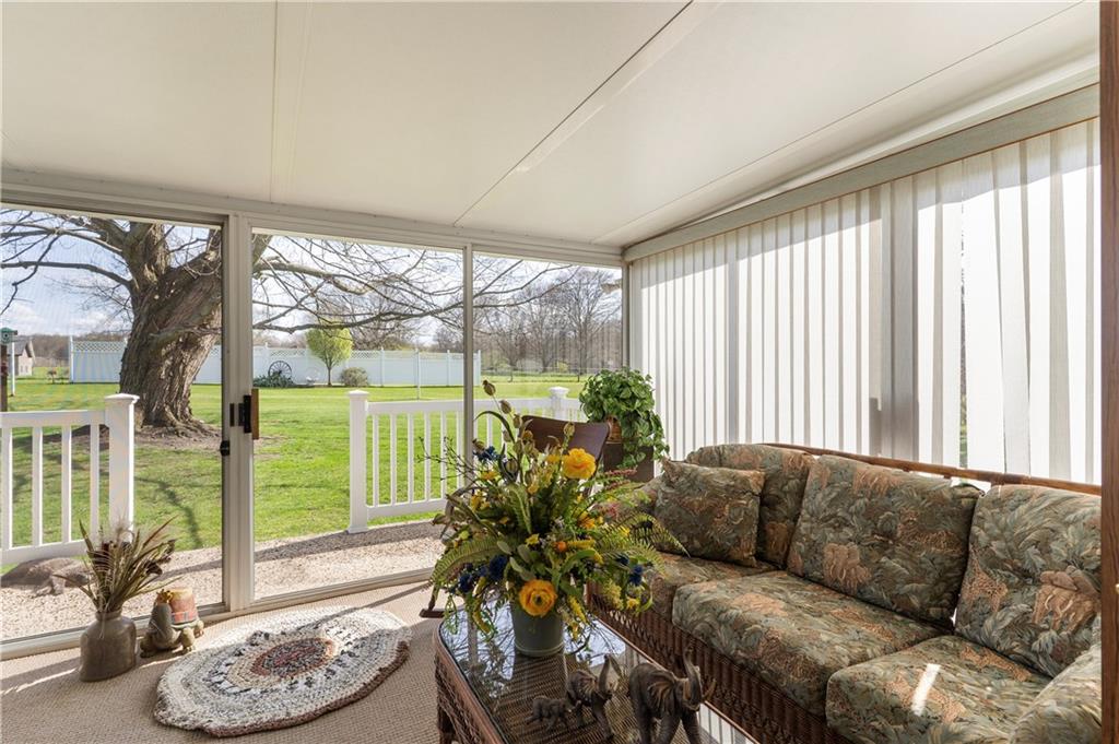 946 Crouser School Road Sandy Lake, PA 16145 - Photo 9 of 41 a living room with furniture and a large window