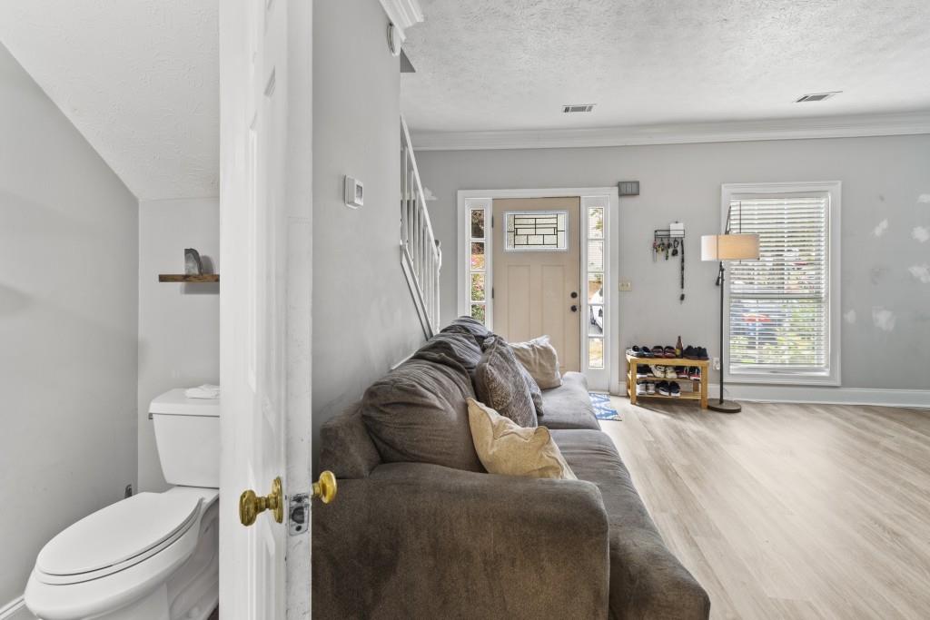 3509 Mt Vernon Circle Atlanta, GA 30340 - Photo 11 of 20 a living room with furniture a flat screen tv and a toilet