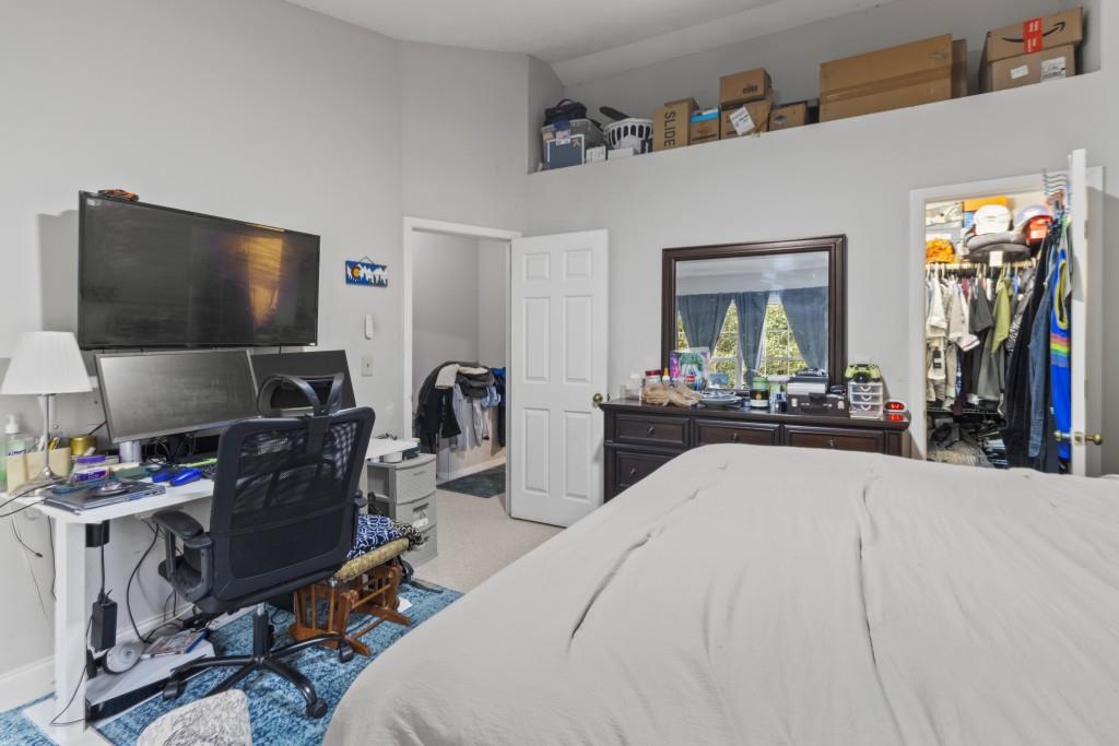 3509 Mt Vernon Circle Atlanta, GA 30340 - Photo 13 of 20 a bedroom with a bed and a flat screen tv