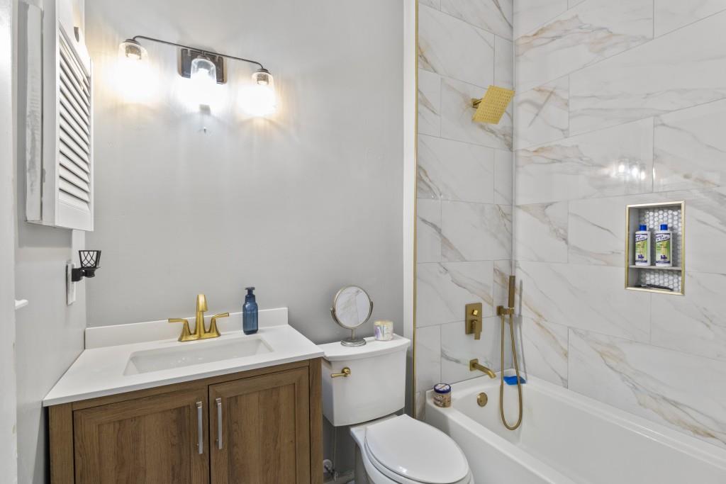 3509 Mt Vernon Circle Atlanta, GA 30340 - Photo 14 of 20 a bathroom with a sink toilet and shower
