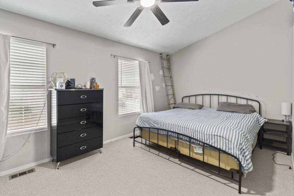 3509 Mt Vernon Circle Atlanta, GA 30340 - Photo 15 of 20 a bedroom with a bed and a ceiling fan