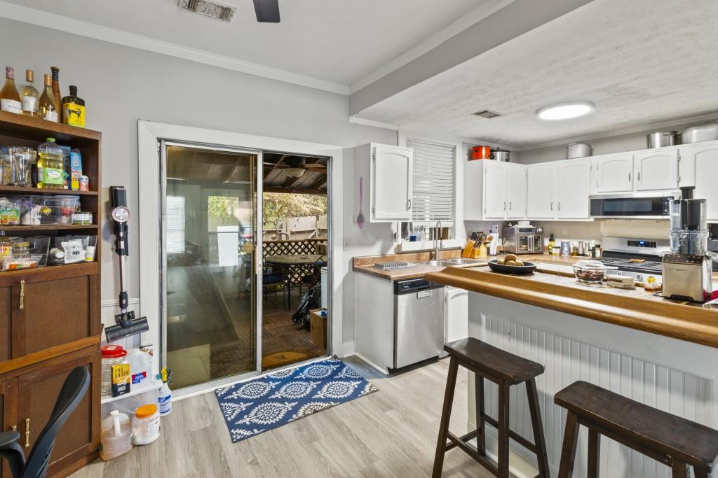 3509 Mt Vernon Circle Atlanta, GA 30340 - Photo 4 of 20 a kitchen with stainless steel appliances granite countertop a refrigerator and a stove top oven