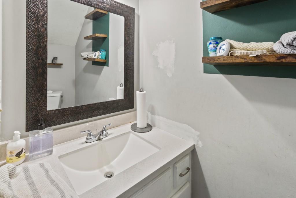 3509 Mt Vernon Circle Atlanta, GA 30340 - Photo 10 of 20 a bathroom with a sink and a mirror