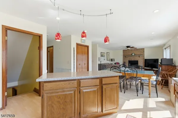 a view of a dining hall with dining table and chairs