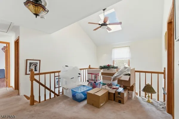 a view of a livingroom with furniture and windows