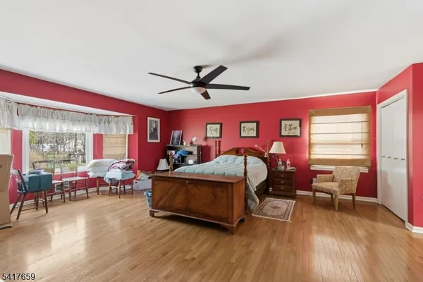 a bed room with a bed and a chair