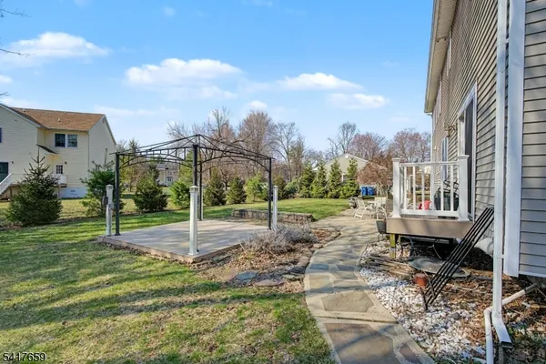 a view of a park that has a car park side of the road