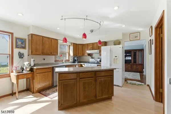 a kitchen with cabinets a sink and appliances