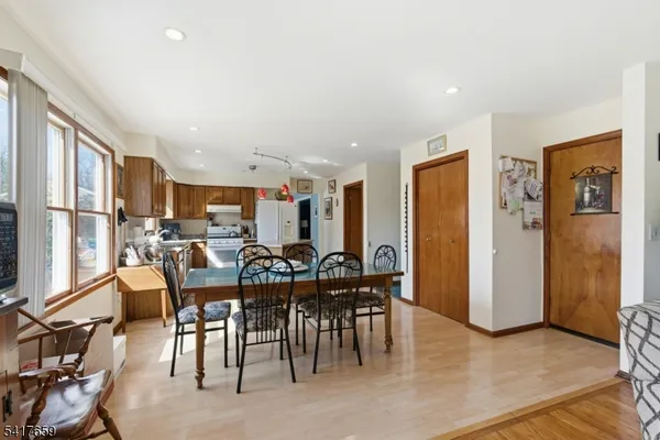 a view of a dining area with furniture window and wooden floor