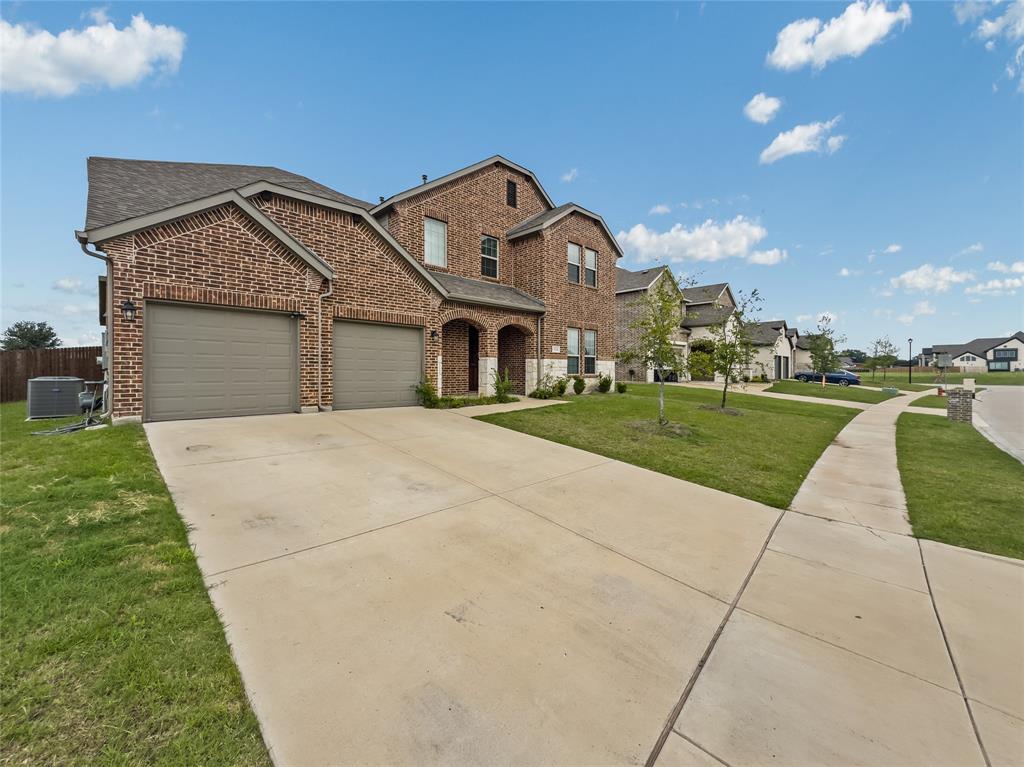 116 Chaco Drive Forney, TX 75126 - Photo 2 of 27 a front view of a house with a yard