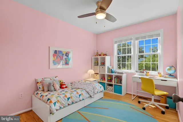 a bedroom with a bed and a desk