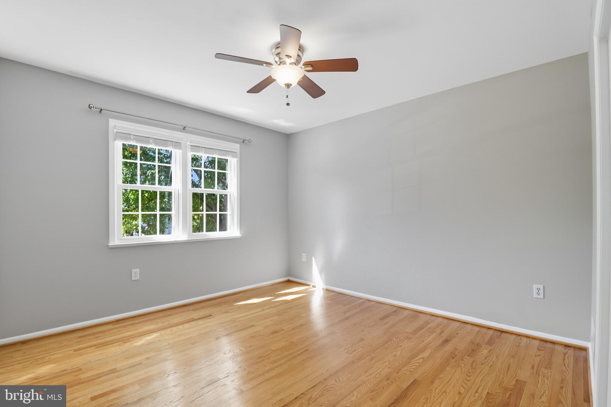 1503 Coat Ridge Road Herndon, VA 20170 - Photo 14 of 39 wooden floor in an empty room with a window