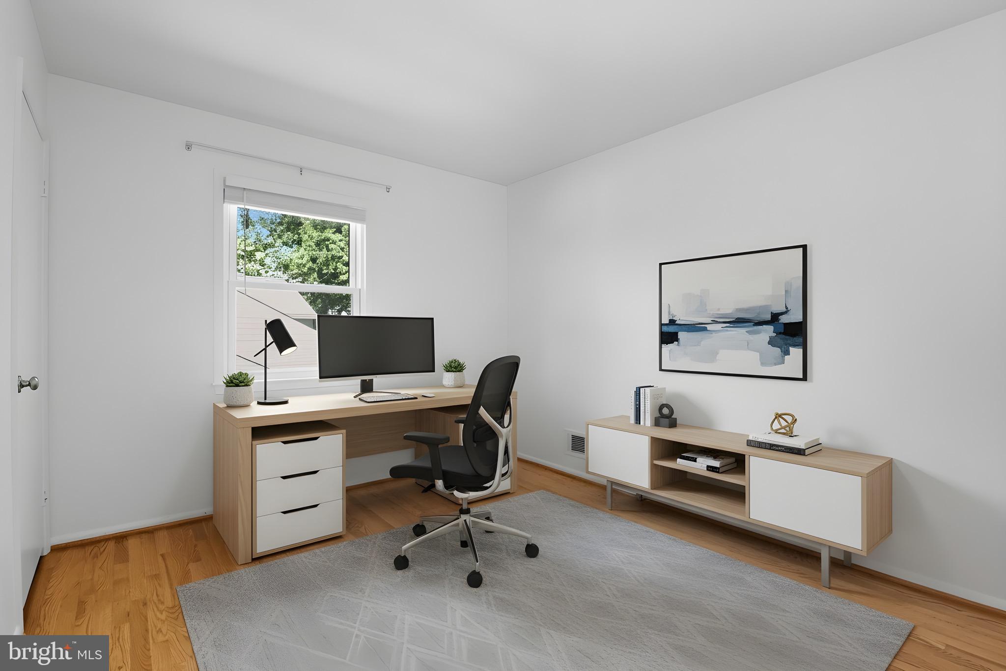 1503 Coat Ridge Road Herndon, VA 20170 - Photo 17 of 39 a view of a workspace with furniture and a window