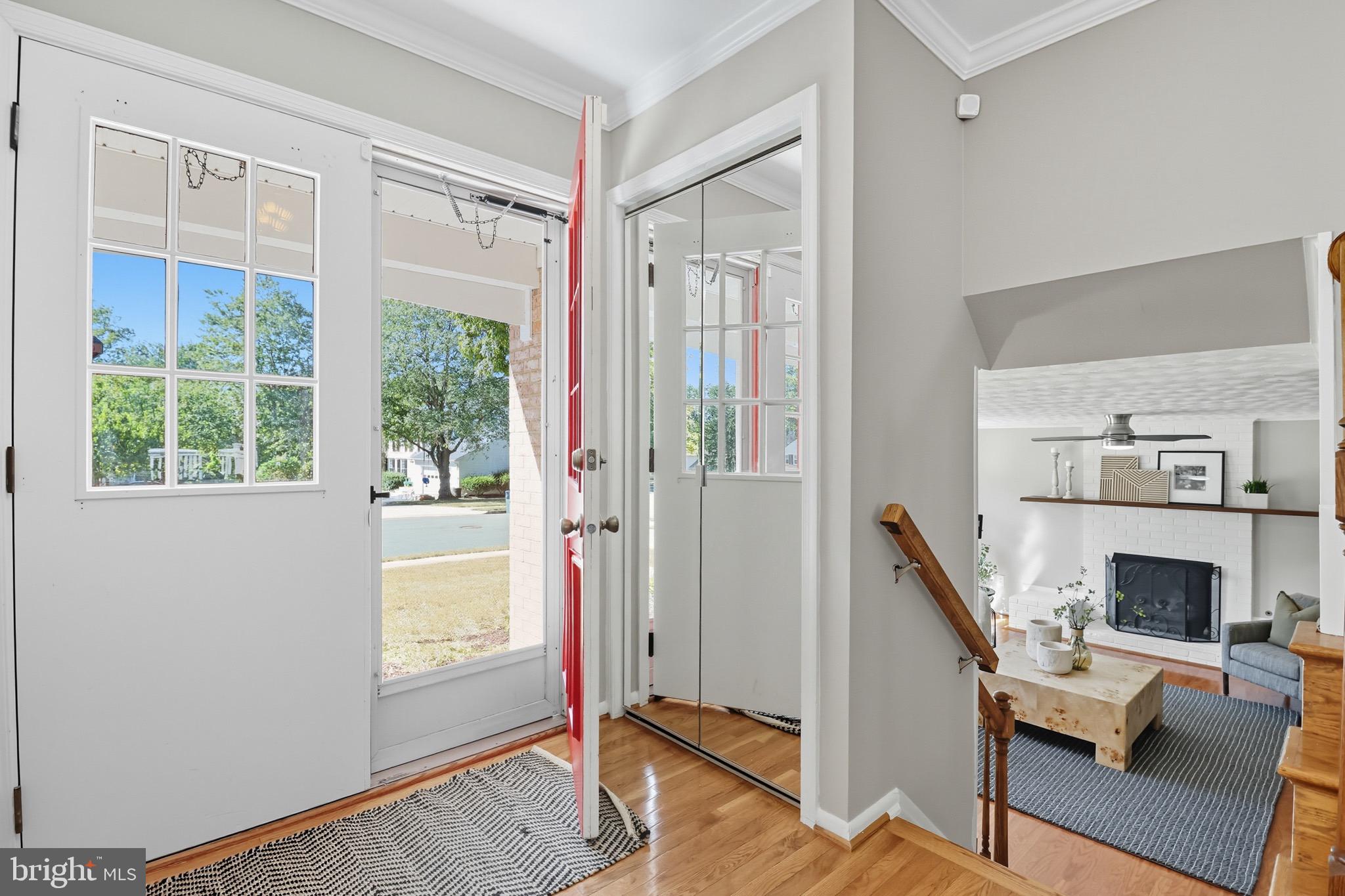 1503 Coat Ridge Road Herndon, VA 20170 - Photo 2 of 39 a view of a livingroom with furniture a fireplace and windows