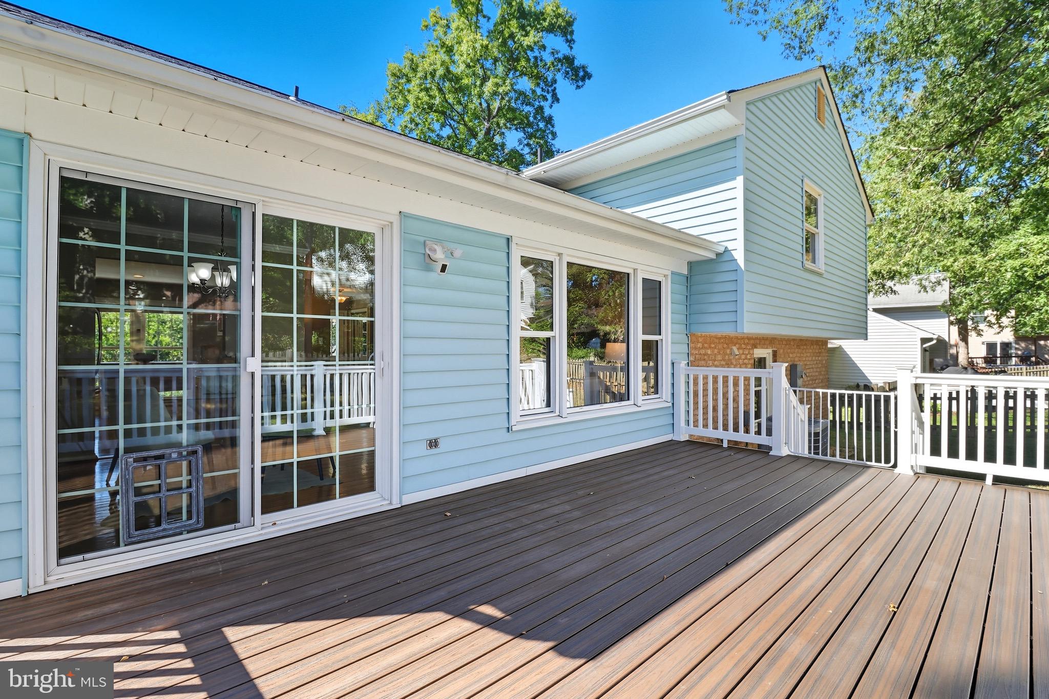 1503 Coat Ridge Road Herndon, VA 20170 - Photo 29 of 39 a view of a house with wooden deck