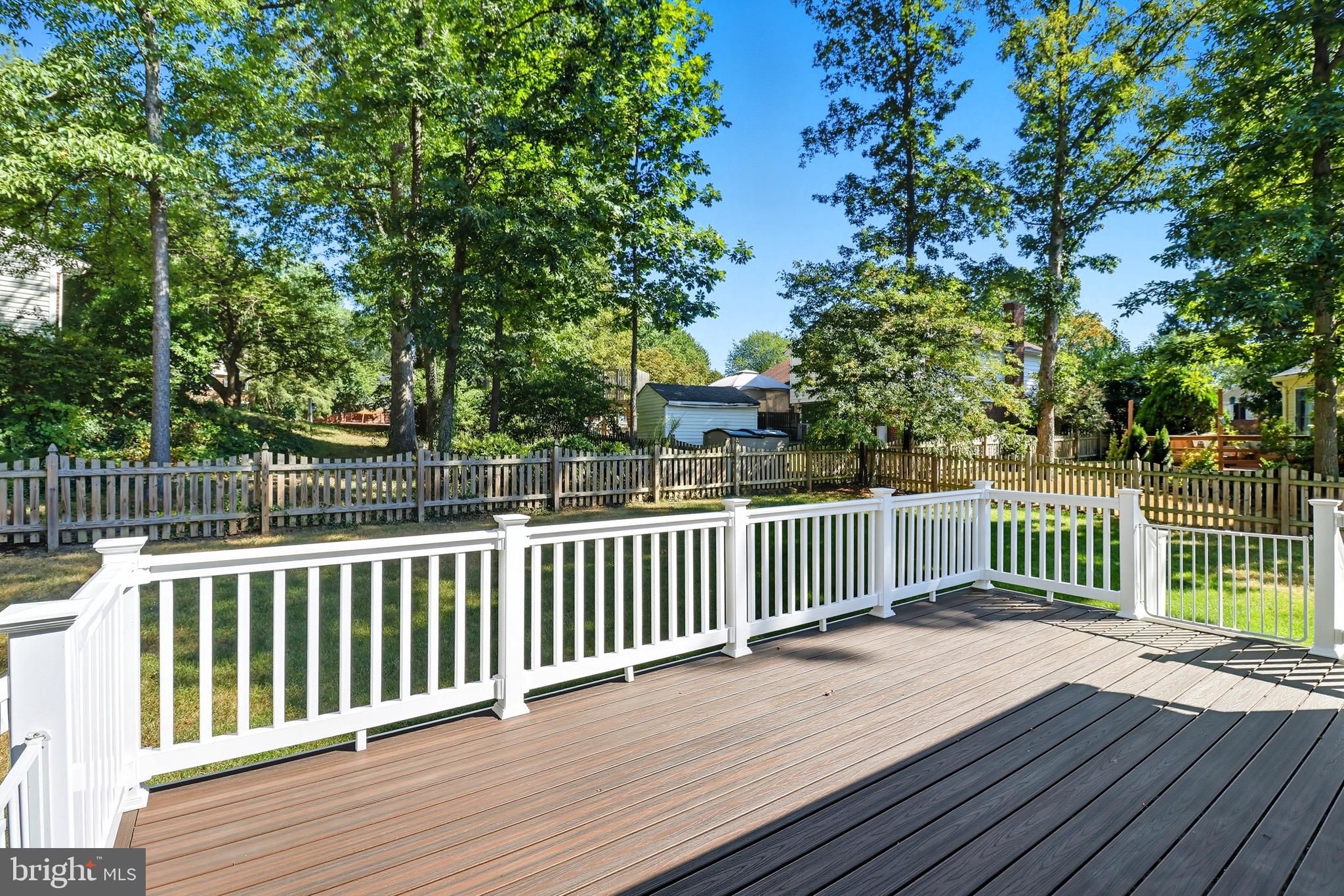 1503 Coat Ridge Road Herndon, VA 20170 - Photo 30 of 39 a view of deck with wooden fence and trees