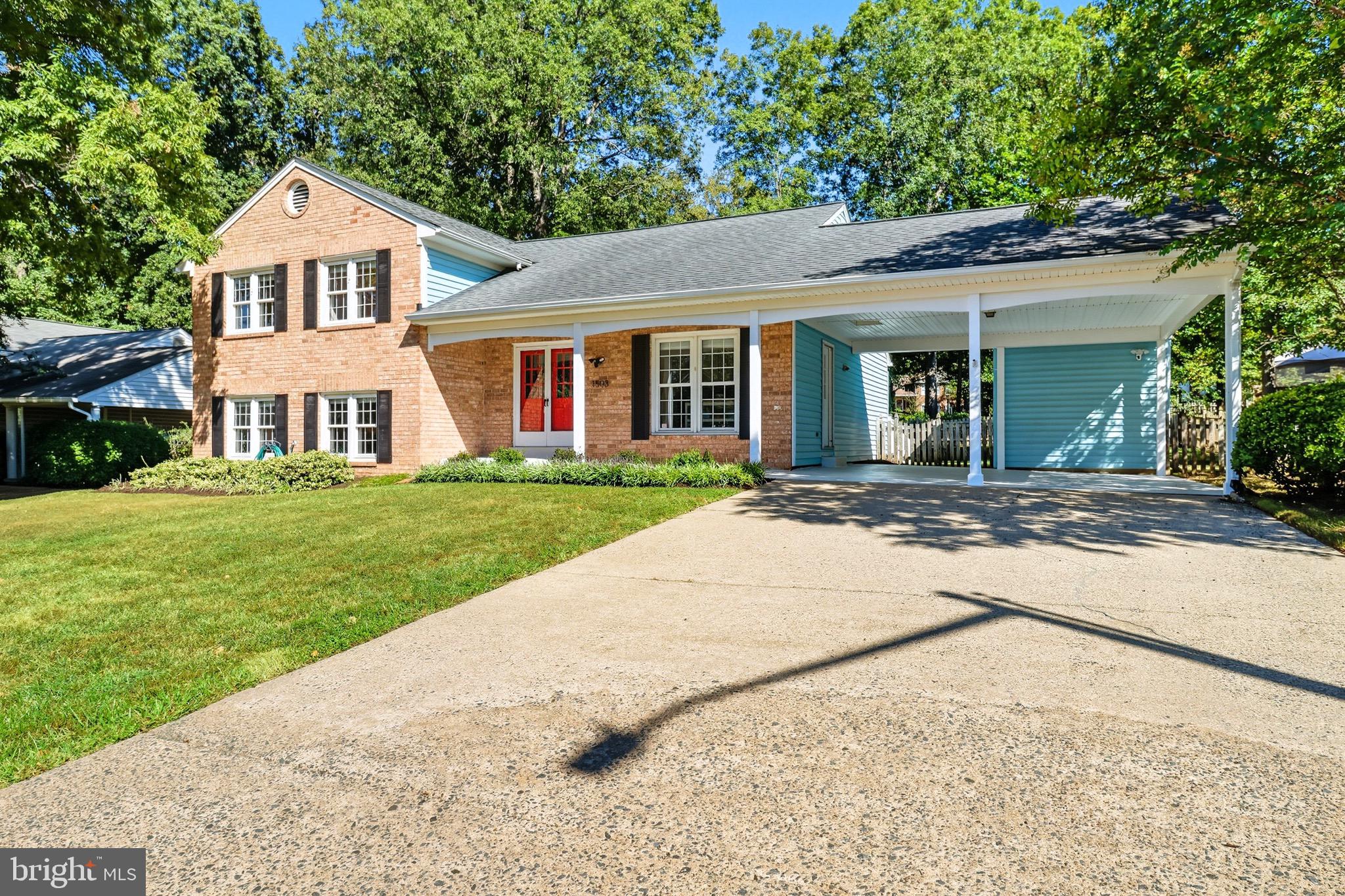 1503 Coat Ridge Road Herndon, VA 20170 - Photo 31 of 39 a front view of a house with a yard and trees