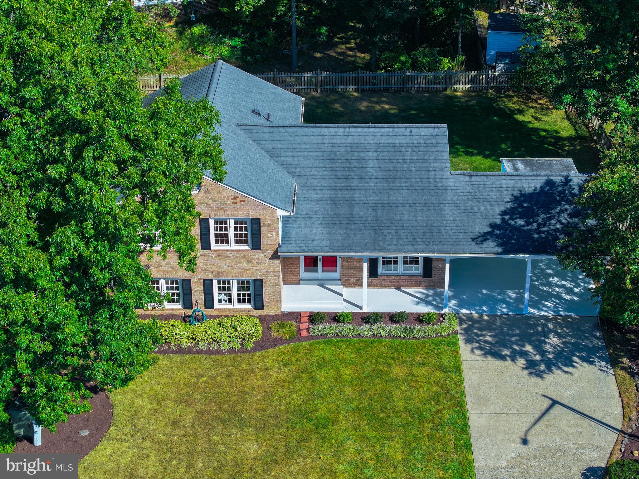 1503 Coat Ridge Road Herndon, VA 20170 - Photo 32 of 39 an aerial view of a house with table and chairs and a yard