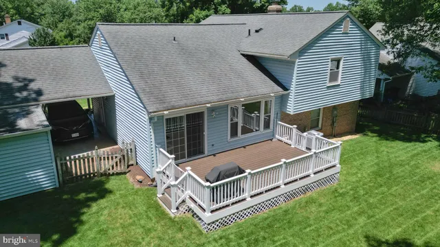 aerial view of a house with a yard