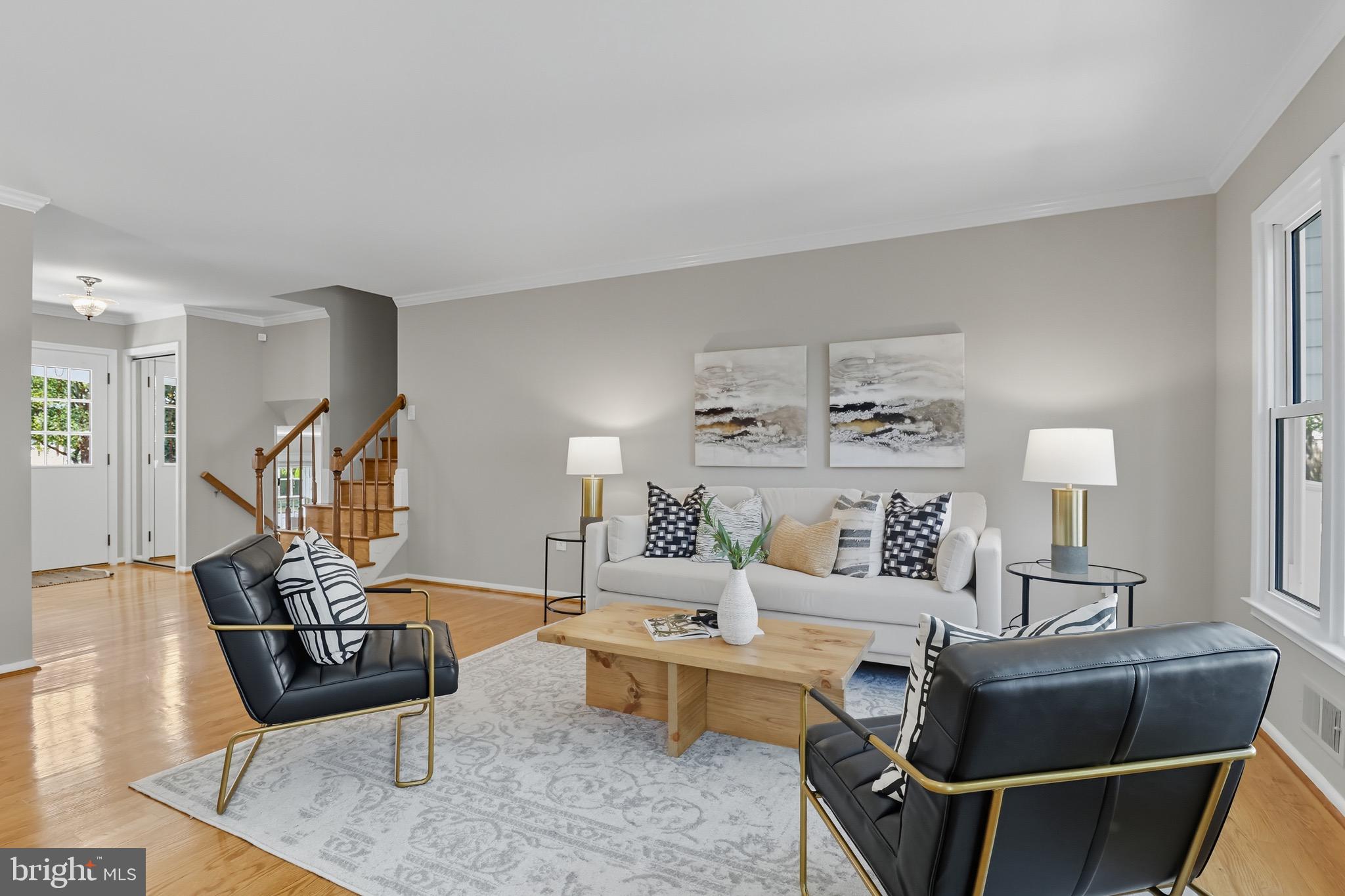 1503 Coat Ridge Road Herndon, VA 20170 - Photo 4 of 39 a living room with furniture and a wooden floor