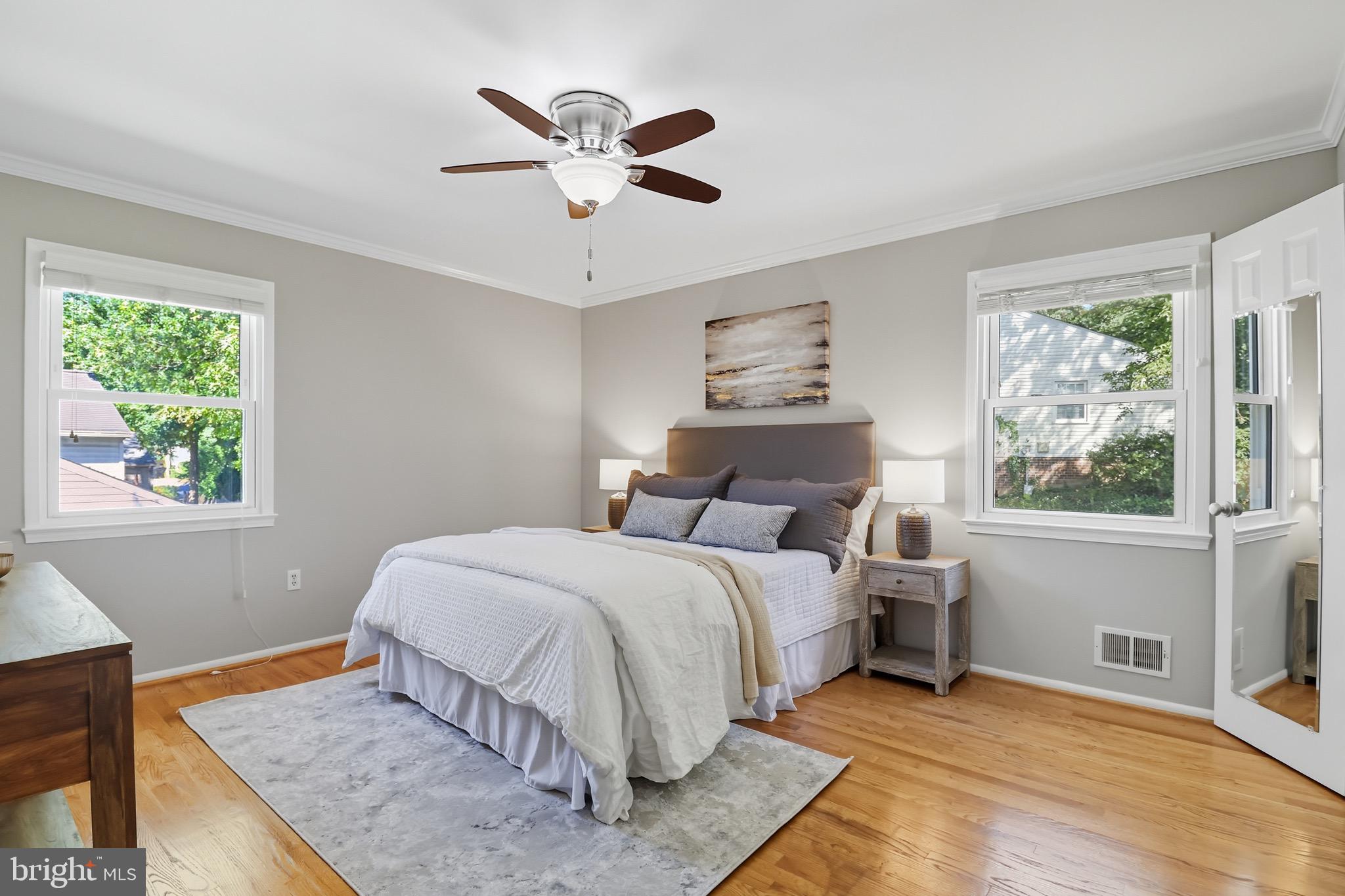 1503 Coat Ridge Road Herndon, VA 20170 - Photo 10 of 39 a bedroom with a large bed and a window