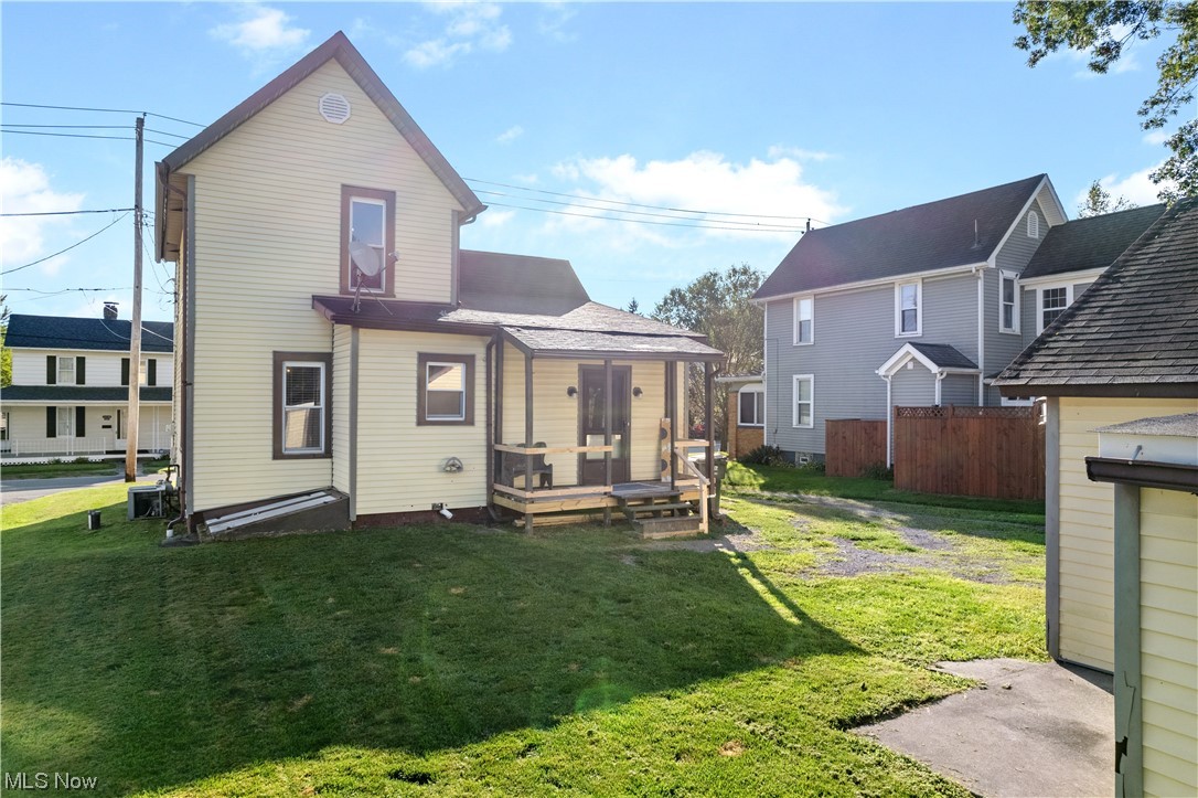 4815 Ridge Avenue Southeast Canton, OH 44707 - Photo 17 of 28 Back of house with a lawn