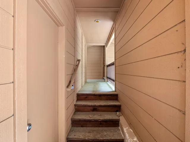 a view of a door and wooden floor