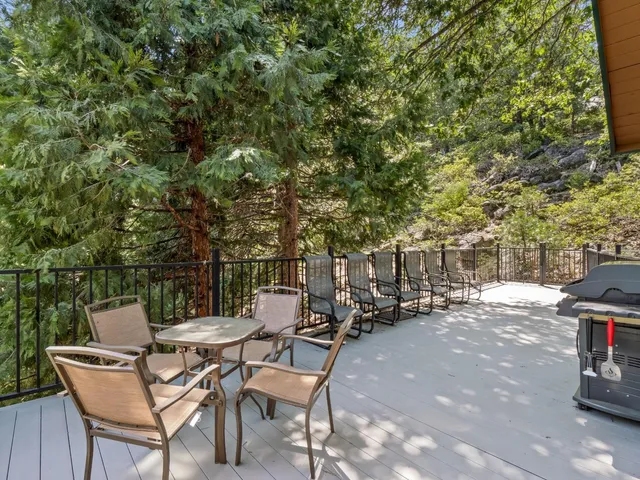 a view of backyard with a table and chairs