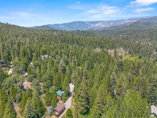 a view of a house with a tree