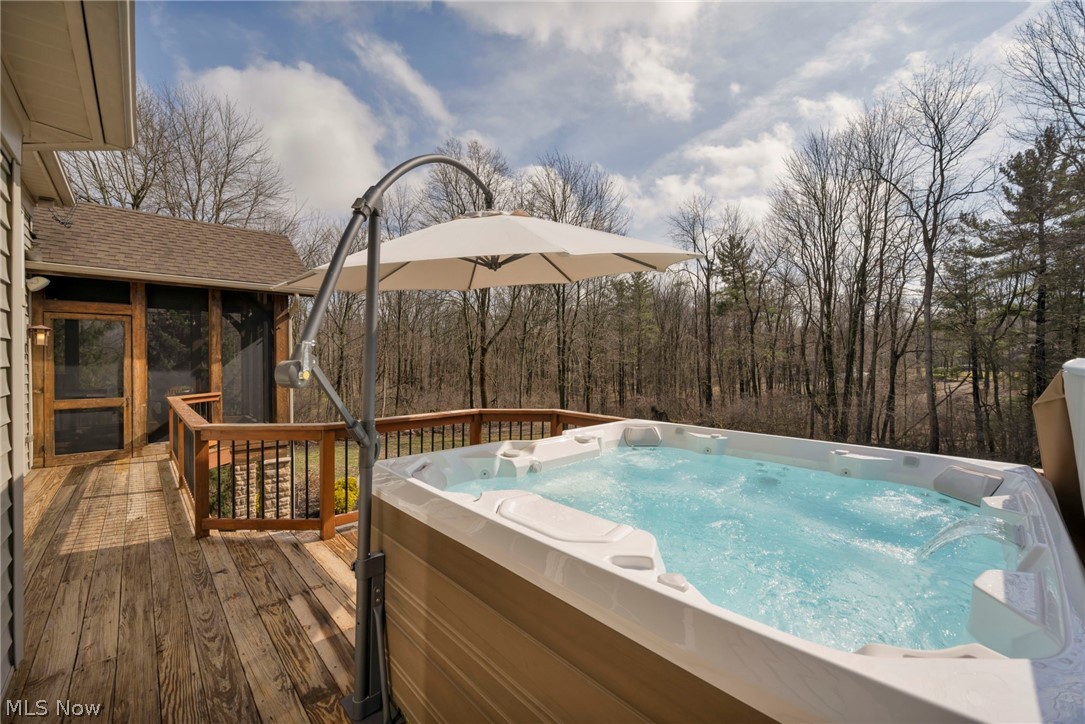 11295 Sutton Place Chardon, OH 44024 - Photo 47 of 50 View of swimming pool featuring a sunroom and a deck