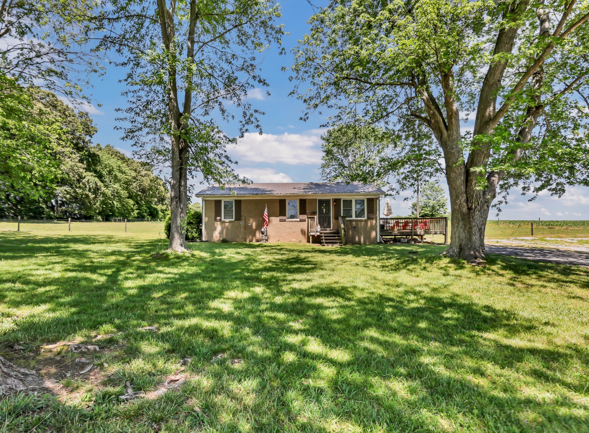 1068 Hugh Hunter Road Oak Grove, KY 42262 - Photo 2 of 30 a front view of a house with a garden