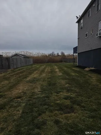 a view of a lake with houses in background