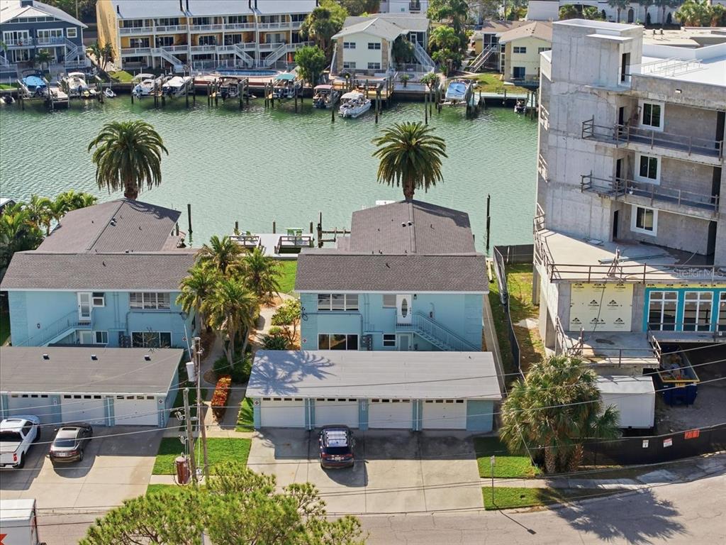 231 Skiff Point, Unit 7 Clearwater Beach, FL 33767 - Photo 1 of 55 an aerial view of a house with a lake view