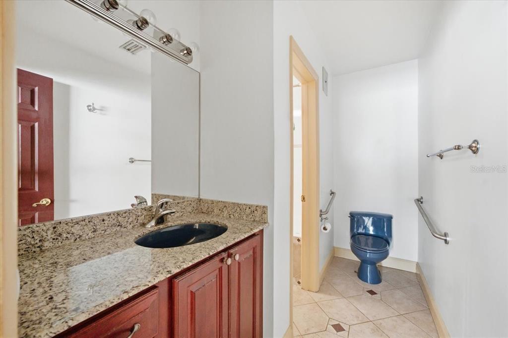 231 Skiff Point, Unit 7 Clearwater Beach, FL 33767 - Photo 23 of 55 a bathroom with a sink toilet and shower