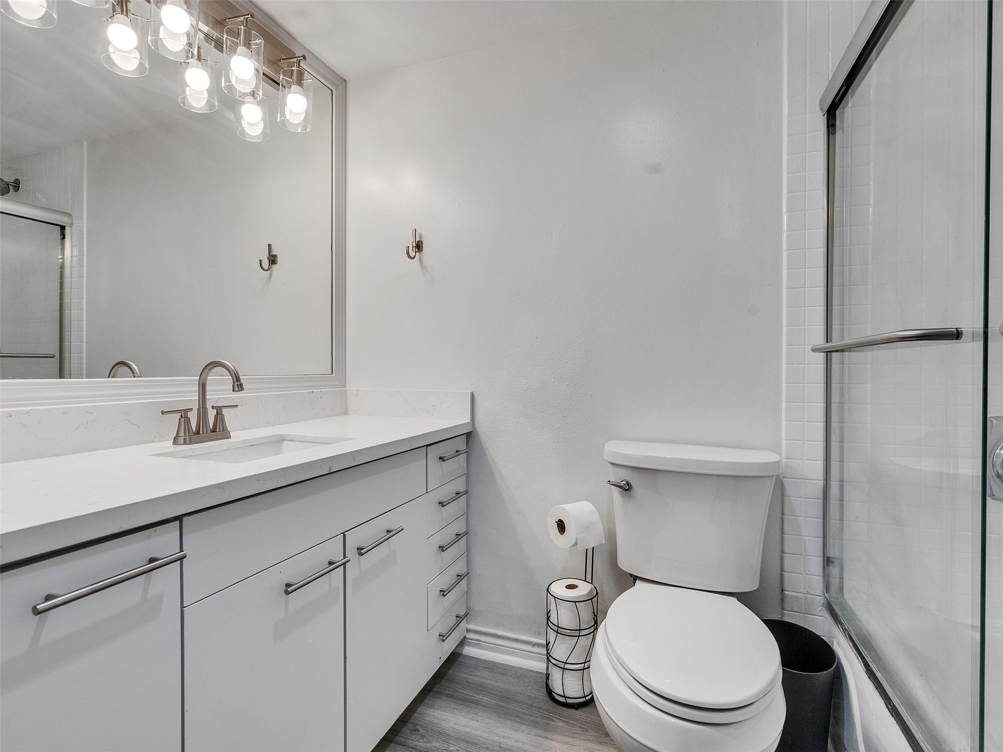 3525 Sage Road, Unit 812 Houston, TX 77056 - Photo 19 of 28 a white toilet sitting next to a bathroom sink