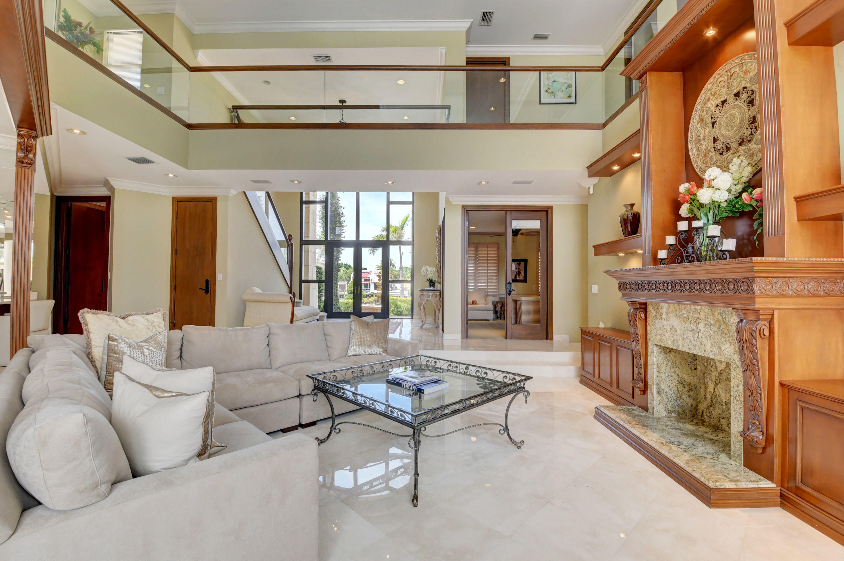 860 Northeast 79th Street Boca Raton, FL 33487 - Photo 13 of 109 a living room with furniture a fireplace and a large window